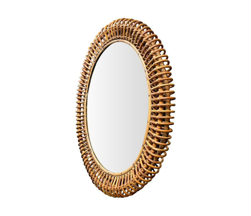 An oval Italian 1970s mirror by Franco Albini with thick hand woven bamboo frame