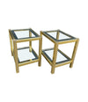 A pair of French 1970s gilt metal side tables by Pierre Vandel with original part mirrored glass shelves