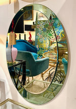 An Italian 1960s Crystal Arte oval mirror with pastel mint green mirrored frame