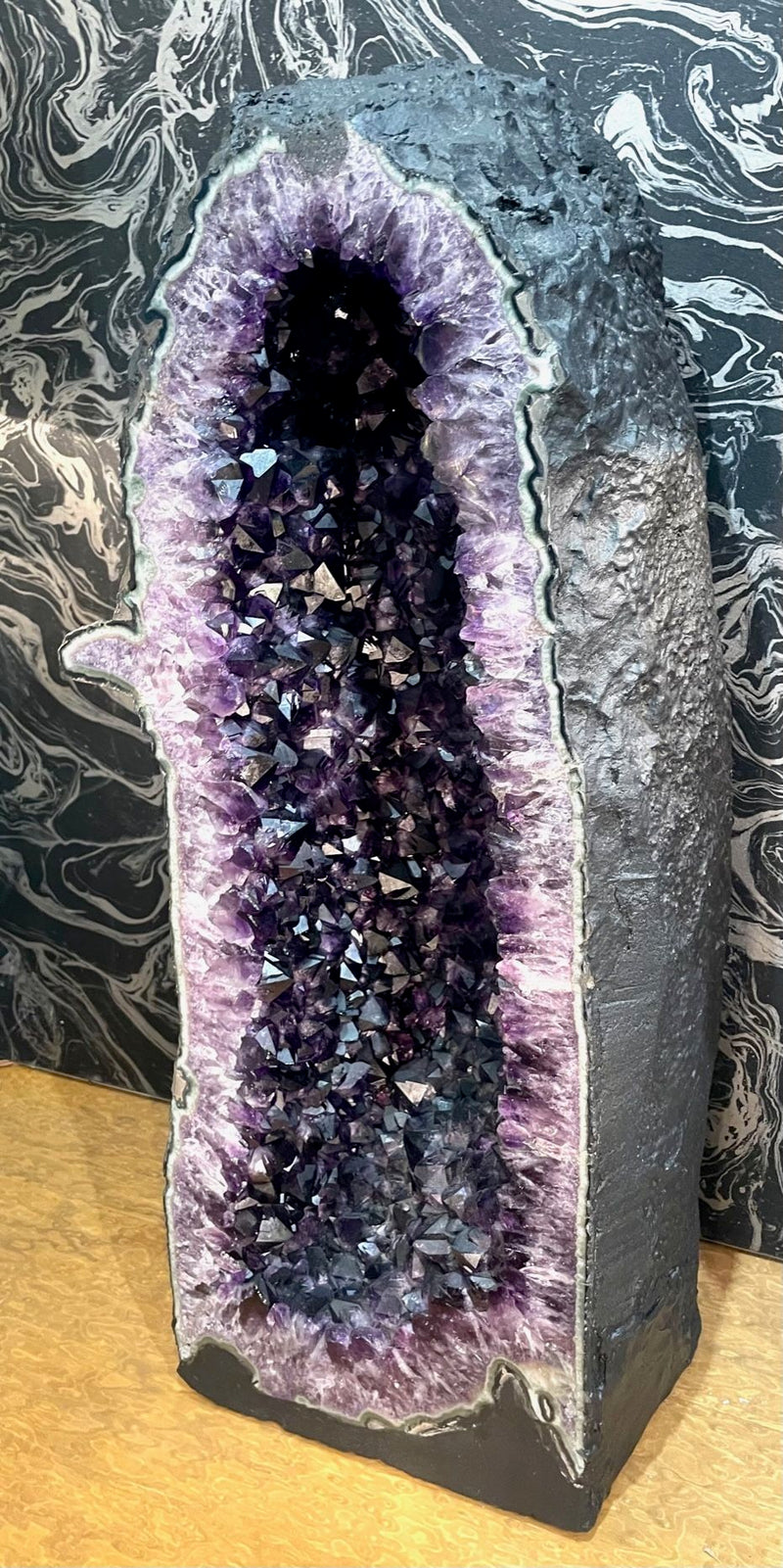 A stunning, large, high quality amethyst crystal geode cave