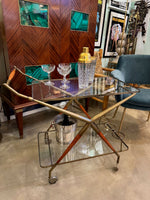 An Italian 1950s brass and lacquered wood bar trolley by Cesare Lacca