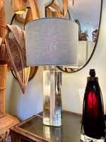 A pair of 1960s Orrefors heavy glass lamps with white glass core and nickel fittings