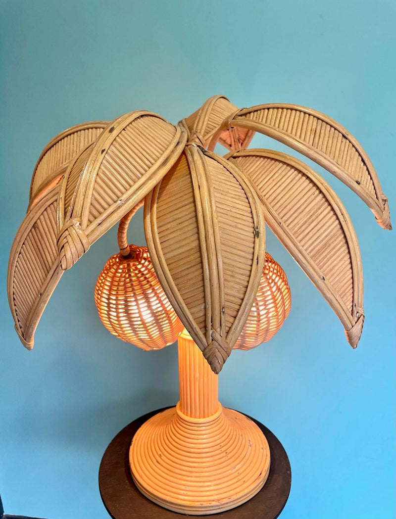 A bamboo palm tree table lamp in the style of Mario Lopez Torres with two lights