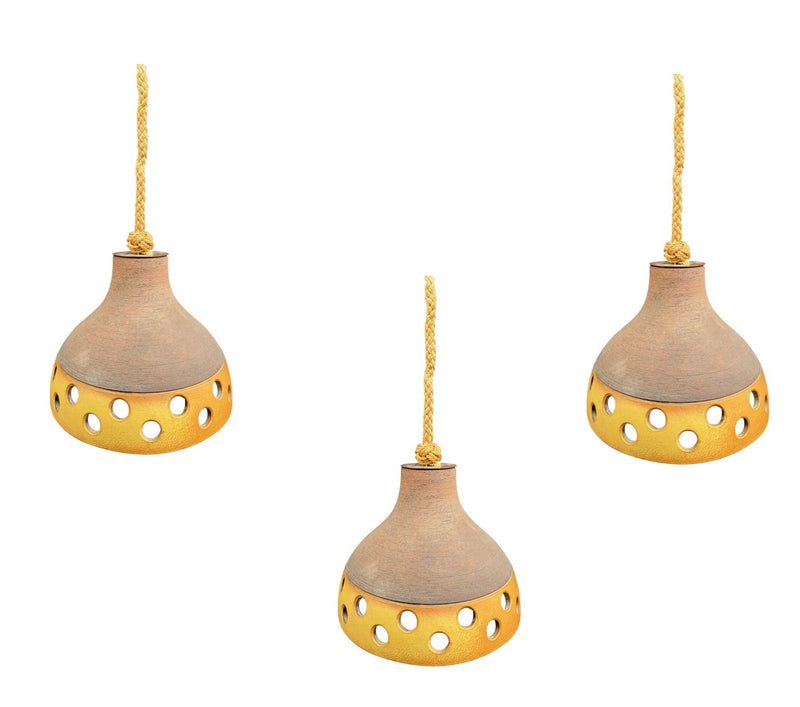 A set of three 1960s French glazed ceramic ceiling lights suspended from thick knotted rope