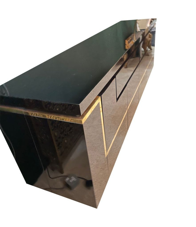 A 1970s vintage black piano lacquer sideboard by Jean Claude Mahey for Roche Bobois with brass detail