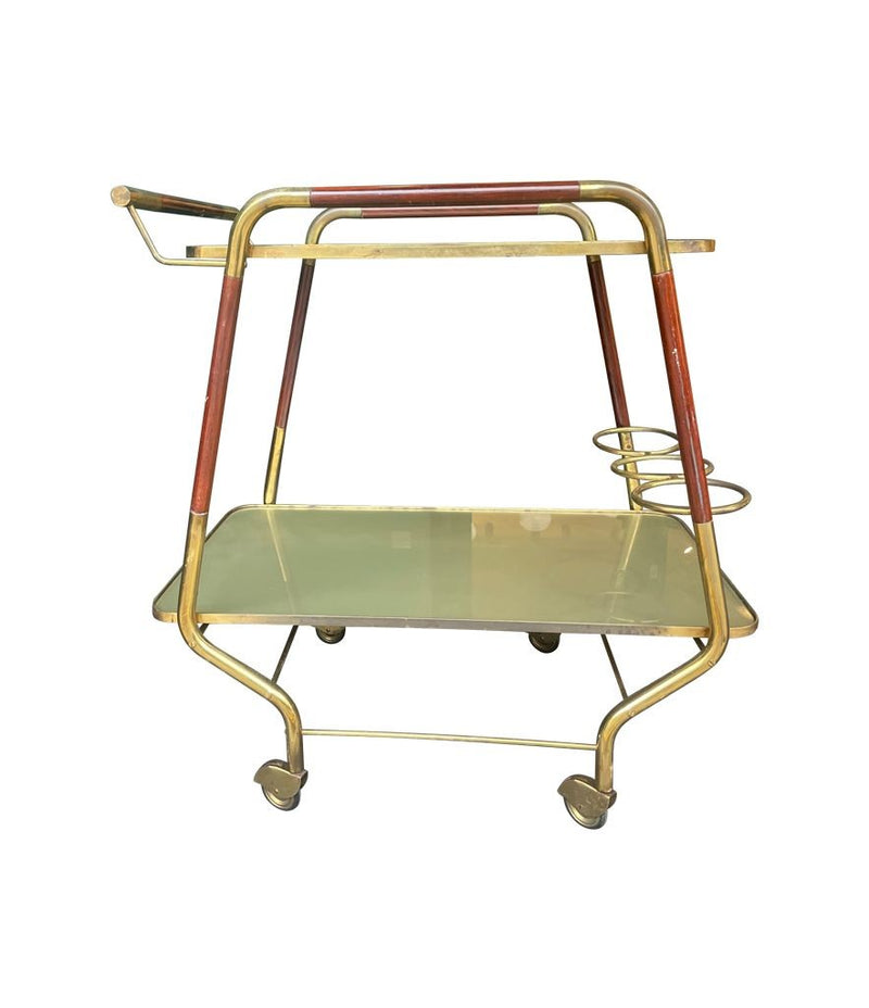 Vintage drinks trolley by Cesare Lacca, gold and lacquered wood with gold painted glass shelves, brass bottle holder and original brass castors. Italian Circa 1950s 