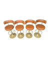 A set of four Börje Johanson “Jupiter” bar stools in cognac faux leather