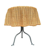 An Italian 1970s woven rattan "draped" side table with cost iron legs