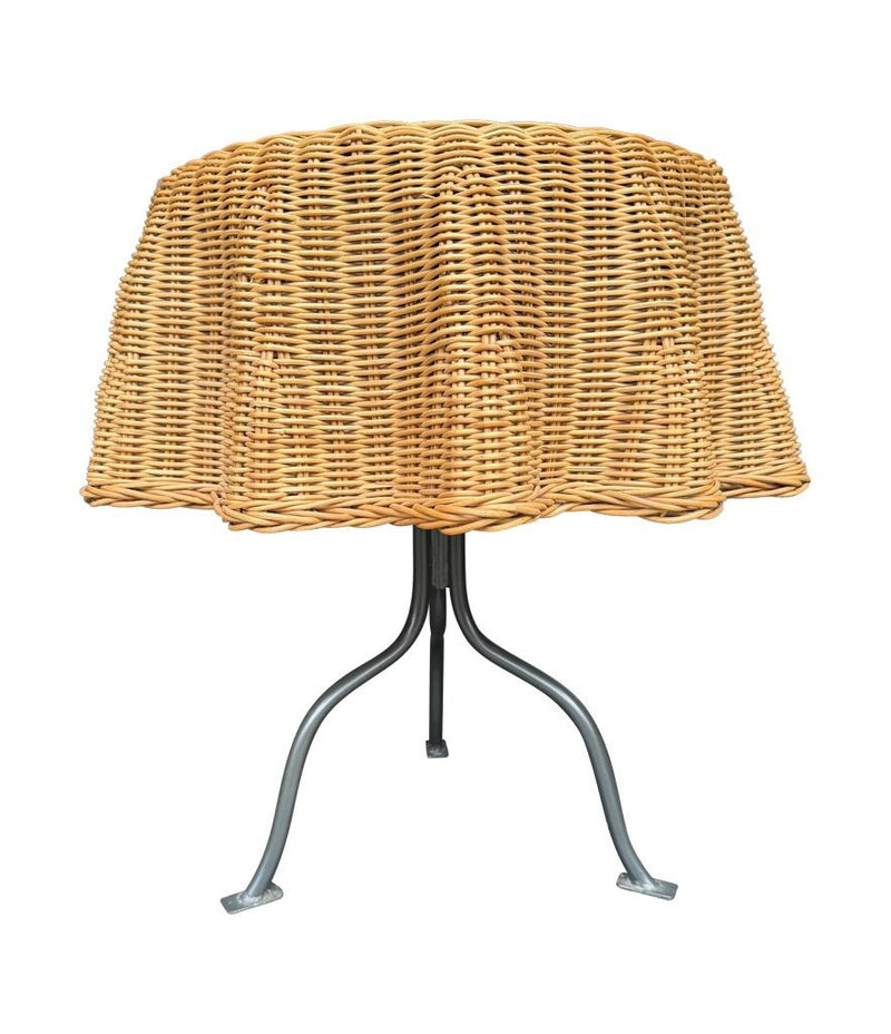 An Italian 1970s woven rattan "draped" side table with cost iron legs
