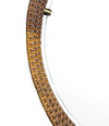 A circular 1950s Italian woven rattan mirror by Cantu, Roma with brass detail