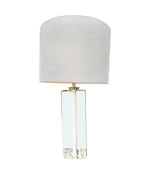 A pair of 1960s Orrefors heavy glass lamps with white glass core and nickel fittings