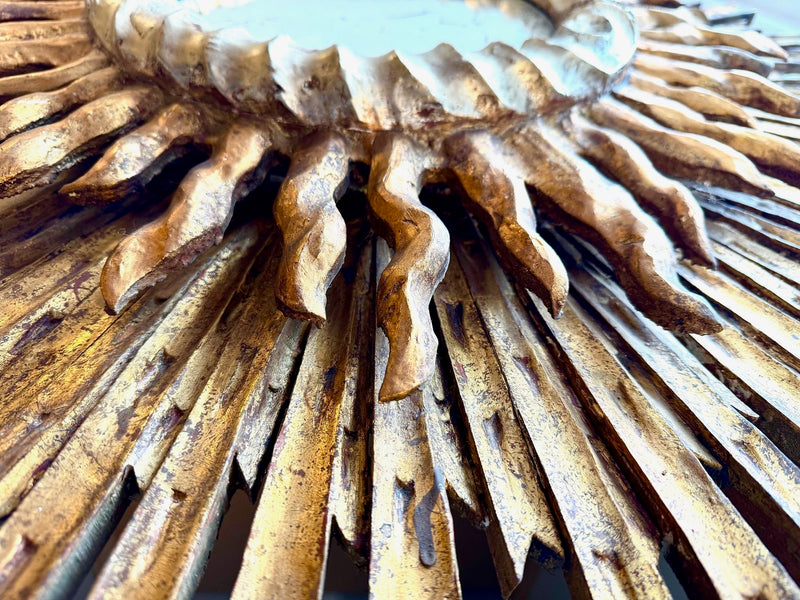 A large 1940s French carved wood gilt sunburst mirror