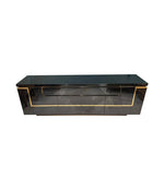 A 1970s vintage black piano lacquer sideboard by Jean Claude Mahey for Roche Bobois with brass detail