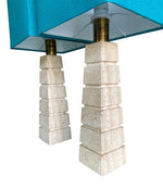 Mid Century table lamps with Travertine bases and brass fittings with blue linen shades