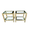 A pair of French 1970s gilt metal side tables by Pierre Vandel with original part mirrored glass shelves