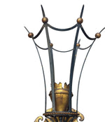 A large pair of Italian 1940s torchiere gilt and black metal wall sconces