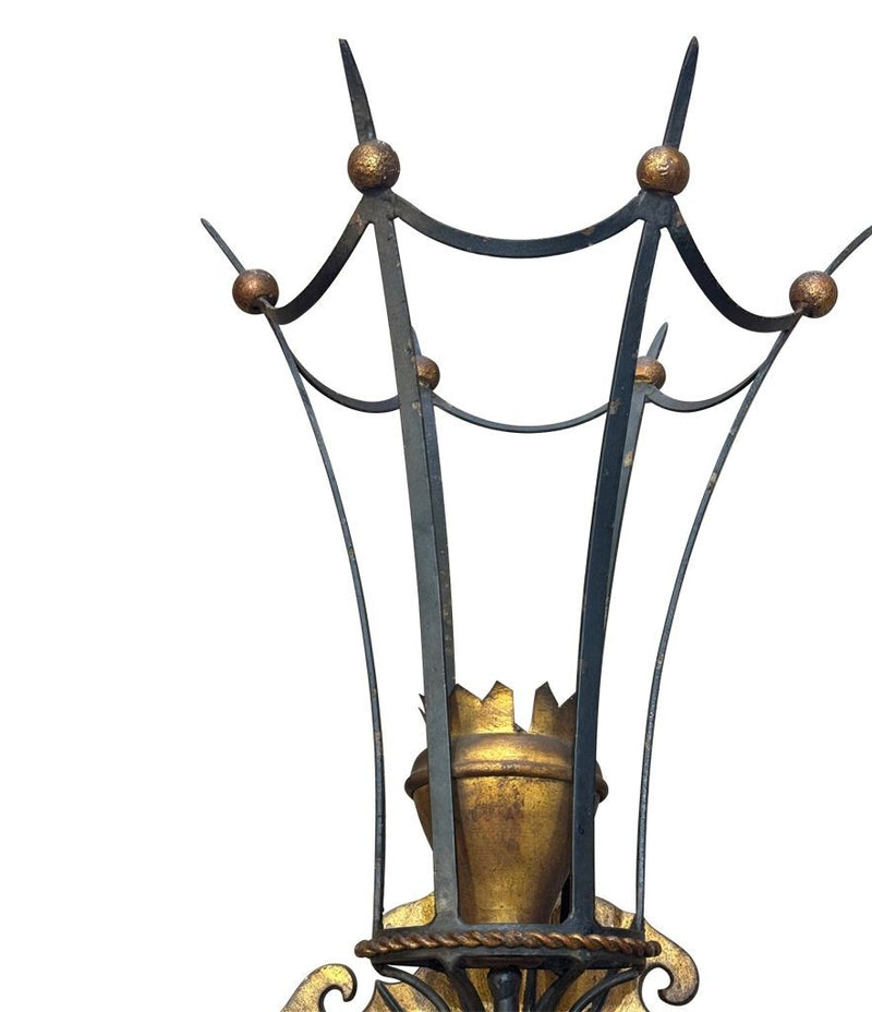 A large pair of Italian 1940s torchiere gilt and black metal wall sconces