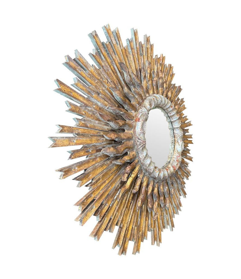 A large 1940s French carved wood gilt sunburst mirror