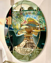 An Italian 1960s Crystal Arte oval mirror with pastel mint green mirrored frame