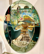 An Italian 1960s Crystal Arte oval mirror with pastel mint green mirrored frame