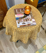 An Italian 1970s woven rattan "draped" side table with cost iron legs