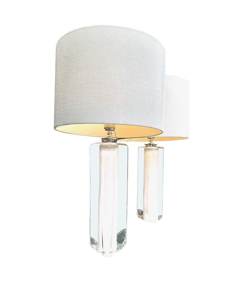 A pair of 1960s Orrefors heavy glass lamps with white glass core and nickel fittings