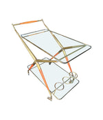 An Italian 1950s brass and lacquered wood bar trolley by Cesare Lacca