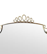 An orignal pair of 1950s Gio Ponti style Italian portrait brass framed mirror with brass top scroll detailing