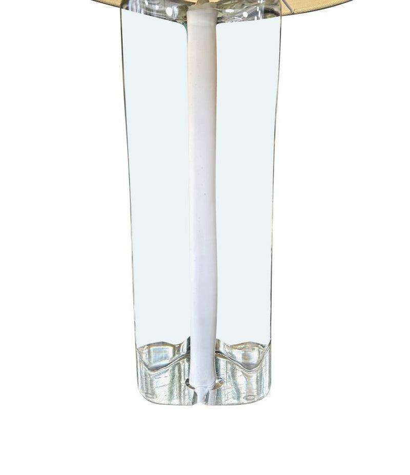 A pair of 1960s Orrefors heavy glass lamps with white glass core and nickel fittings