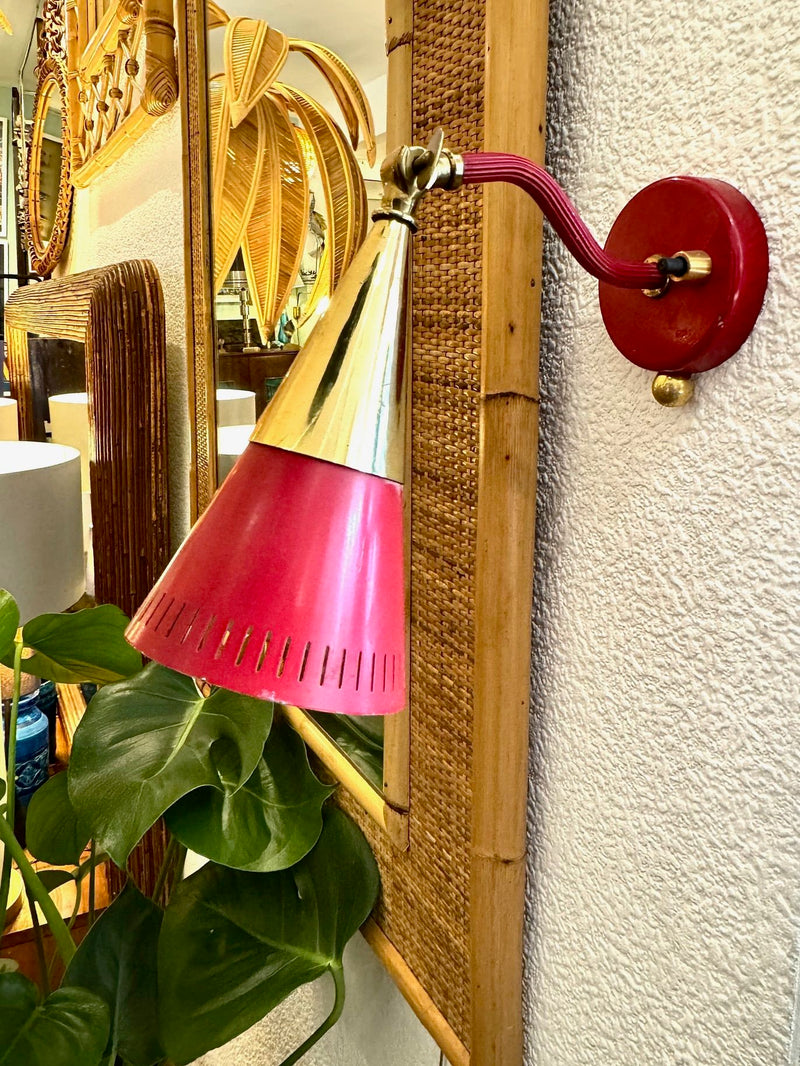 A pair of Holm Sorensen 1950s red enamelled metal and brass adjustable wall lights