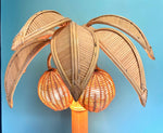 A bamboo palm tree table lamp in the style of Mario Lopez Torres with two lights