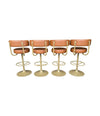 A set of four Börje Johanson “Jupiter” bar stools in cognac faux leather