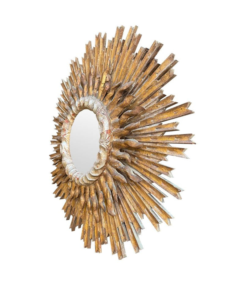 A large 1940s French carved wood gilt sunburst mirror
