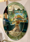 An Italian 1960s Crystal Arte oval mirror with pastel mint green mirrored frame