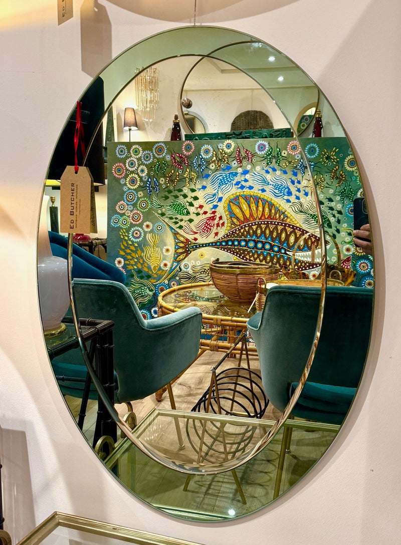 An Italian 1960s Crystal Arte oval mirror with pastel mint green mirrored frame