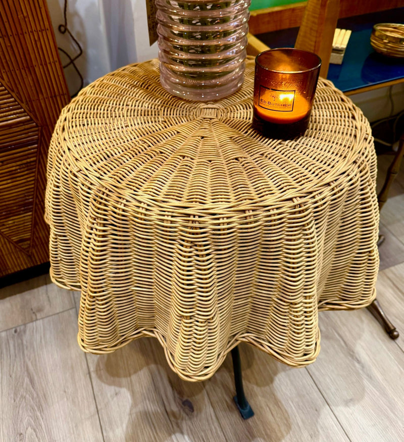An Italian 1970s woven rattan "draped" side table with cost iron legs