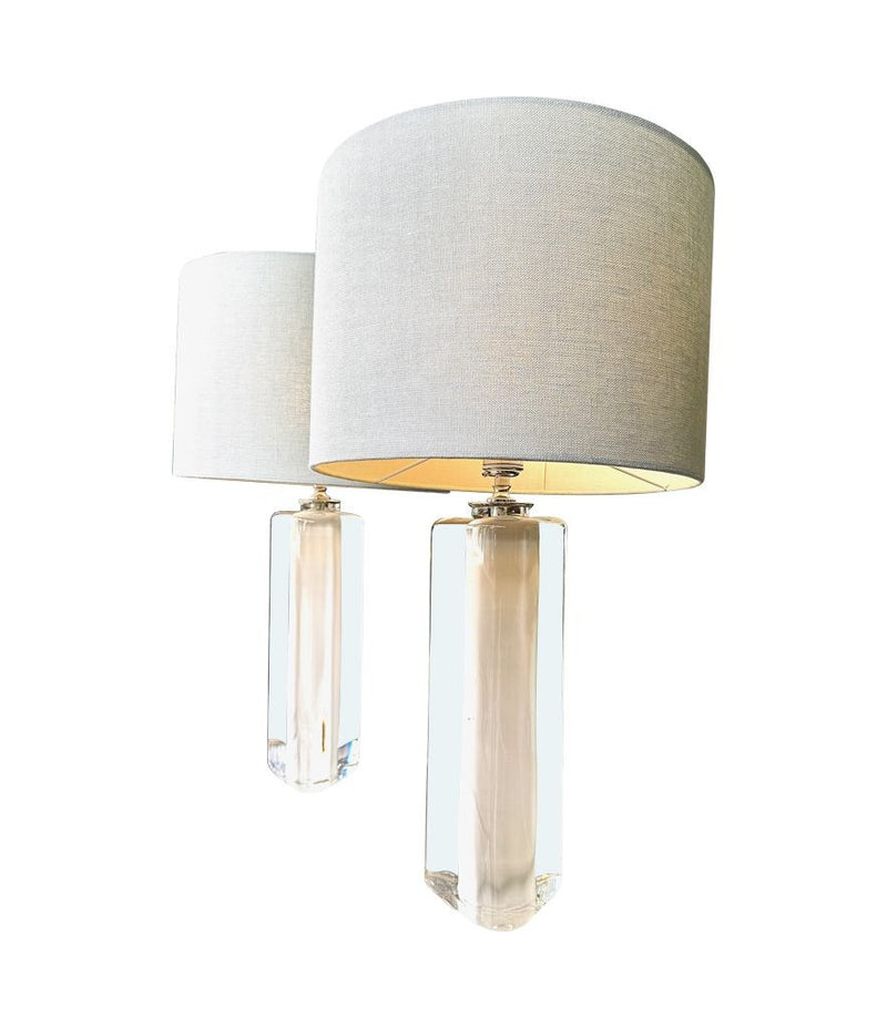 A pair of 1960s Orrefors heavy glass lamps with white glass core and nickel fittings