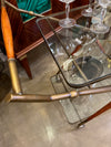 An Italian 1950s brass and lacquered wood bar trolley by Cesare Lacca