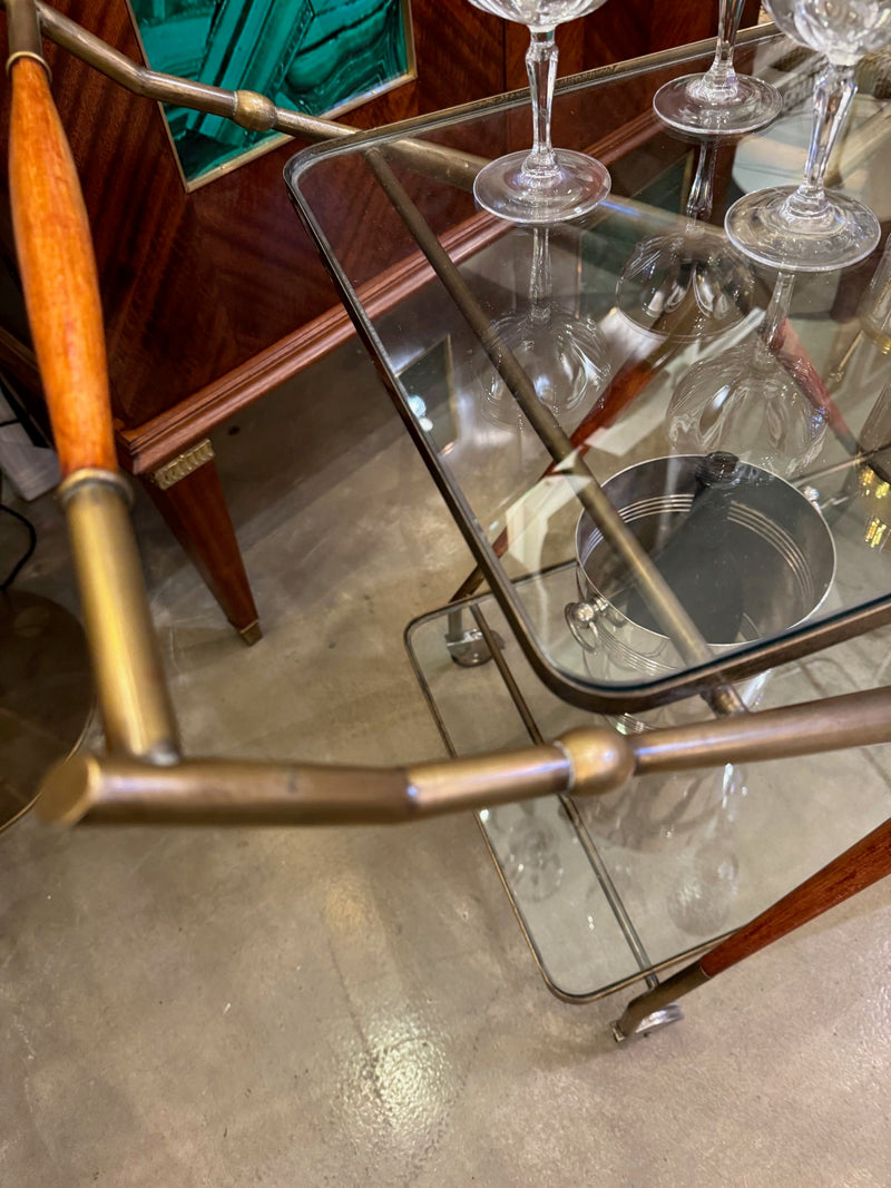 An Italian 1950s brass and lacquered wood bar trolley by Cesare Lacca