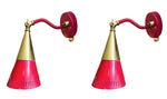 A pair of Holm Sorensen 1950s red enamelled metal and brass adjustable wall lights