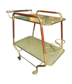 Vintage drinks trolley by Cesare Lacca, gold and lacquered wood with gold painted glass shelves, brass bottle holder and original brass castors. Italian Circa 1950s 