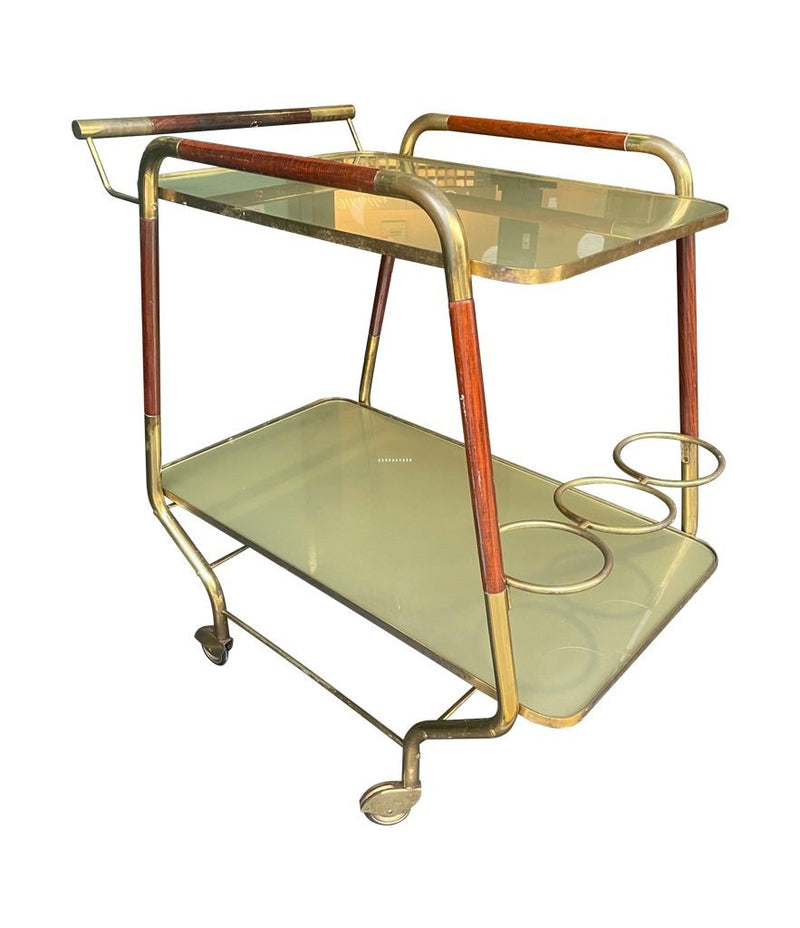 Vintage drinks trolley by Cesare Lacca, gold and lacquered wood with gold painted glass shelves, brass bottle holder and original brass castors. Italian Circa 1950s 