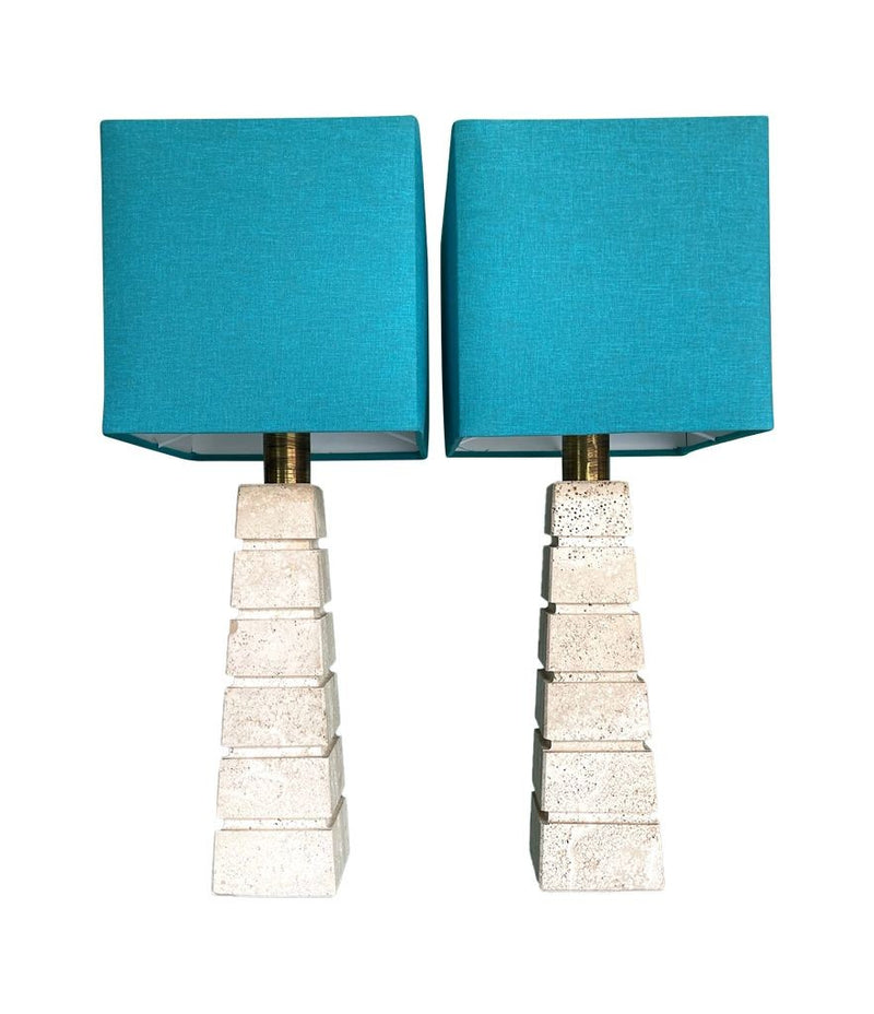 Mid Century table lamps with Travertine bases and brass fittings with blue linen shades