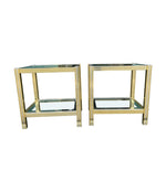 A pair of French 1970s gilt metal side tables by Pierre Vandel with original part mirrored glass shelves