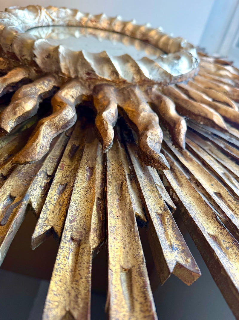 A large 1940s French carved wood gilt sunburst mirror