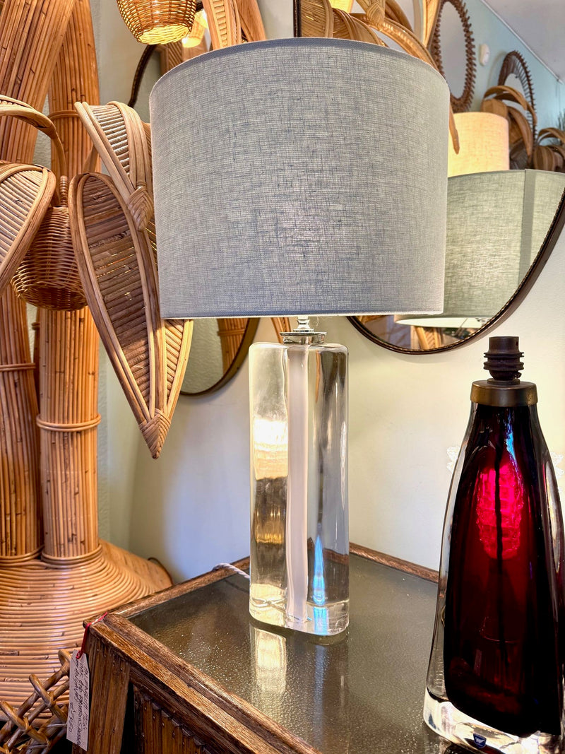 A pair of 1960s Orrefors heavy glass lamps with white glass core and nickel fittings