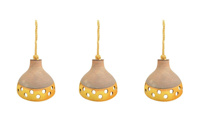 A set of three 1960s French glazed ceramic ceiling lights suspended from thick knotted rope