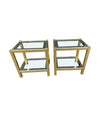 A pair of French 1970s gilt metal side tables by Pierre Vandel with original part mirrored glass shelves