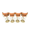 A set of four Börje Johanson “Jupiter” bar stools in cognac faux leather