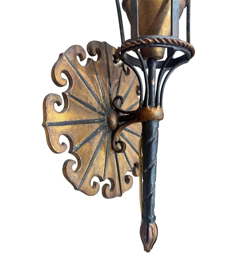 A large pair of Italian 1940s torchiere gilt and black metal wall sconces